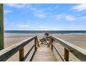 Wooden walkway to beach with ocean view at 1681 E Ashley Ave # A & B, Folly Beach, SC 29439