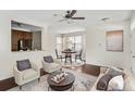 Living room with hardwood floors, a dining area, and a view of the kitchen at 1762 Bee Balm Rd, Johns Island, SC 29455