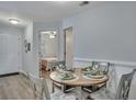 Bright dining area with table set for four and view into bedroom at 2345 Tall Sail Dr # C, Charleston, SC 29414