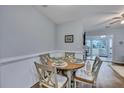 Dining area with round table and four chairs, near sunroom at 2345 Tall Sail Dr # C, Charleston, SC 29414