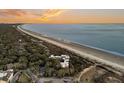 Aerial view of beachfront property with ocean and coastal landscape at 2371 Shipwatch Rd, Kiawah Island, SC 29455