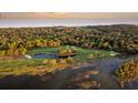 Aerial view of golf course with water features and surrounding landscape at 2371 Shipwatch Rd, Kiawah Island, SC 29455