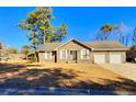 Brick ranch home with attached two-car garage at 303 Swamp Fox Ln, Goose Creek, SC 29445