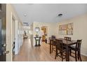 Light-toned dining area with a wooden table and chairs at 309 Julia Caroline Ave # A, Moncks Corner, SC 29461