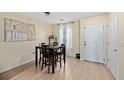 Dining area with a wooden table and four chairs at 309 Julia Caroline Ave # A, Moncks Corner, SC 29461