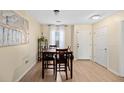 Dining area with a wooden table and chairs near the entryway at 309 Julia Caroline Ave # A, Moncks Corner, SC 29461