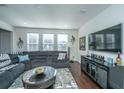 Spacious living room with sectional sofa and large TV at 3157 Timberline Dr, Johns Island, SC 29455