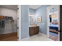 Elegant bathroom with a vanity, walk-in closet, and hardwood floors at 374 Trailmore Ln, Summerville, SC 29486