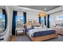 Bright and airy main bedroom with a king-size bed and plenty of natural light at 374 Trailmore Ln, Summerville, SC 29486