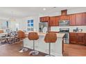 Modern kitchen with stainless steel appliances and breakfast bar at 534 Mclernon Trace, Johns Island, SC 29455