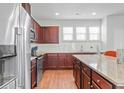 Spacious kitchen featuring granite countertops and wood cabinets at 534 Mclernon Trace, Johns Island, SC 29455