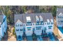 Aerial view of three-story townhome with gray siding, and gray roof shingles at 113 Claret Cup Way, Charleston, SC 29414