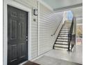 Apartment building exterior showcasing a private entrance and exterior staircase at 130 River Landing Dr # 7210, Daniel Island, SC 29492