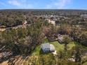 Aerial view of a house nestled in a wooded neighborhood at 1421 Brownswood Rd, Johns Island, SC 29455