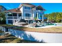 Luxury pool and spa with patio furniture and umbrellas at 1563 Headquarters Plantation Dr, Johns Island, SC 29455