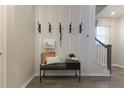 Stylish entryway bench with hooks and decorative pillows at 212 Yorkshire Dr # 5, Moncks Corner, SC 29461