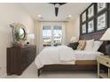 Spacious bedroom with a comfortable bed, dresser, and wall art at 214 Yorkshire Dr # 4, Moncks Corner, SC 29461