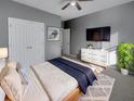 Bedroom with gray walls, a built-in dresser, and a ceiling fan at 217 Forsythia Ave, Summerville, SC 29483