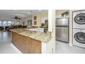 Granite countertops, stainless steel appliances, and breakfast bar at 25 Mariners Cay Dr, Folly Beach, SC 29439