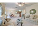 Open concept living space with adjacent dining area and kitchen at 3312 Middlesboro Ave, Summerville, SC 29485