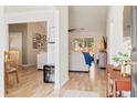 Bright and airy entryway with hardwood floors and views into living room at 344 Slow Mill Dr, Goose Creek, SC 29445
