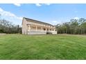 Large two story home with a wrap around porch at 3687 Hilton Dr, Johns Island, SC 29455