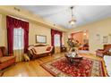 Living room with hardwood floors, antique furniture, and a red rug at 3687 Hilton Dr, Johns Island, SC 29455