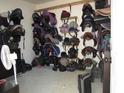 Organized tack room with saddles, bridles, and riding boots at 369 Groomsville Rd, Moncks Corner, SC 29461