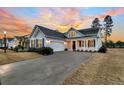 Two-story house with gray siding, white trim, and a two-car garage at 559 Tidewater Chase Ln, Summerville, SC 29486