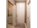 Entryway with a white door and adjacent laundry closet at 60 Fenwick Hall Allee # 924, Johns Island, SC 29455