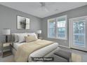 Virtually staged bedroom with private balcony access at 1034 Rosewood Ln, Mount Pleasant, SC 29464