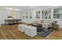 Open concept living and dining area with hardwood floors at 1134 Mim Ave, Charleston, SC 29407