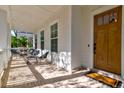 Relaxing front porch with seating and brick flooring at 1525 Kepley Dr, Mount Pleasant, SC 29464
