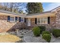 Brick front porch with walkway, landscaping, and bird bath at 2383 Erskine Ct, Charleston, SC 29414