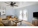 Open living space with double doors and light blue walls at 2383 Erskine Ct, Charleston, SC 29414