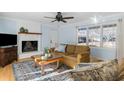 Living room with fireplace, hardwood floors, and comfy seating at 2383 Erskine Ct, Charleston, SC 29414