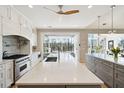 Bright kitchen with expansive island, stainless steel appliances, and access to outdoor space at 2737 Sarazen Dr, Mount Pleasant, SC 29466