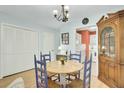 Cozy dining area with round table, four chairs, and built-in hutch at 2757 Jobee Dr # 1101, Charleston, SC 29414