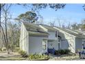 Exterior view of townhome community showcasing a similar light gray townhome at 2757 Jobee Dr # 1101, Charleston, SC 29414