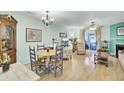 Bright living room with hardwood floors, fireplace, and access to a screened porch at 2757 Jobee Dr # 1101, Charleston, SC 29414