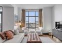 Spacious living area featuring large windows and city views at 5 Gadsdenboro St # 410, Charleston, SC 29401
