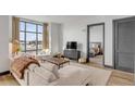 Open living room showcasing sectional sofa and view into bedroom at 5 Gadsdenboro St # 410, Charleston, SC 29401