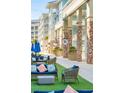 Outdoor seating area with comfortable sofas and chairs, located near shops and restaurants at 5804 Palmetto Dr # A-405/407, Isle of Palms, SC 29451