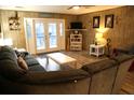 Relaxing living room featuring comfortable seating and access to the deck at 603 Portia St, Edisto Beach, SC 29438