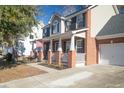 Two-story house with brick and siding exterior, and a attached garage at 9504 Markley Blvd, Summerville, SC 29485