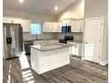 Modern kitchen featuring white shaker cabinets, granite countertops, and stainless steel appliances at 101 Brien, Walterboro, SC 29488