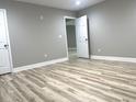 Unfinished basement with gray walls and wood-look flooring at 1034 Weeks Lane, Round O, SC 29474