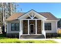 Charming house with a stone facade, covered porch, and manicured lawn at 104 Del Ray Dr, Walterboro, SC 29488