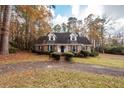 Brick house with driveway, surrounded by trees at 108 Fairway Dr, Summerville, SC 29483