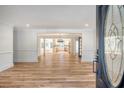 Open concept living area with hardwood floors and kitchen view at 1111 Barrett Rd, Charleston, SC 29407
